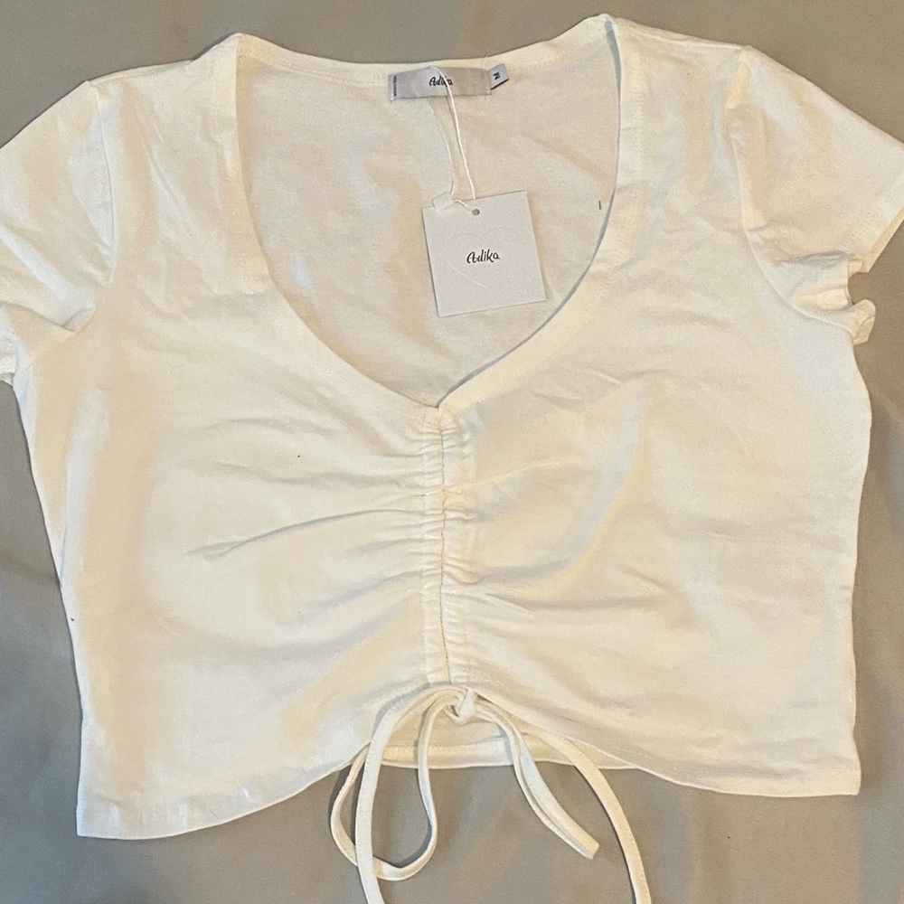 New adjustable crop top from Adika, New with tags, size medium, great condition